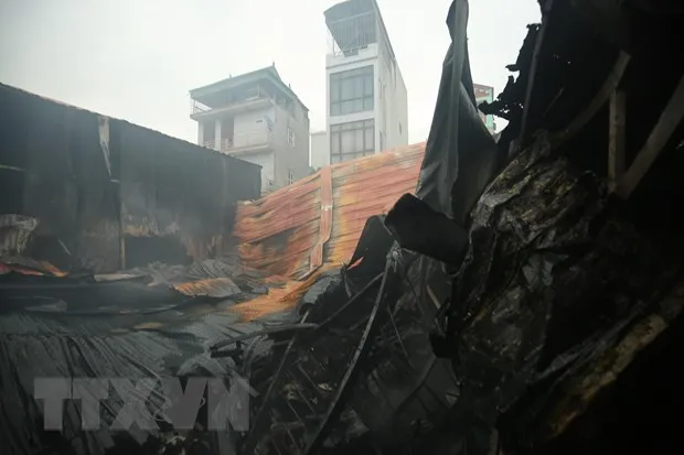 Hiện trường vụ cháy khiến 8 người thiệt mạng tại Hà Nội vào sáng 12/4. Ảnh: TTXVN 