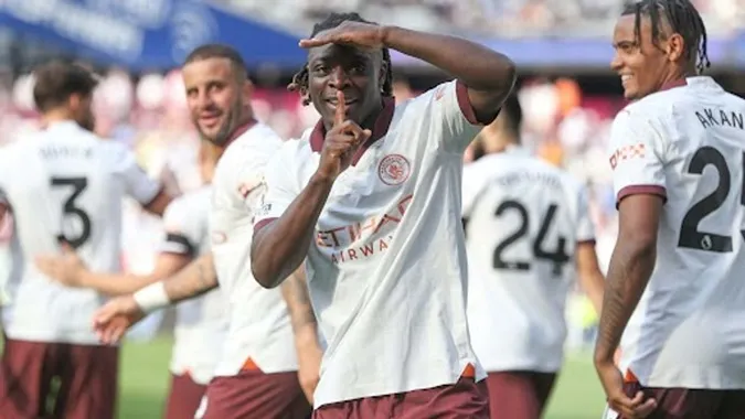 Pep Guardiola thừa nhận không kỳ vọng nhiều vào Doku khi cầu thủ này vừa cập bến Man City - Ảnh: Internet