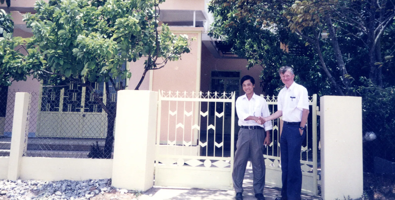 RENEW-Coordinator-Hoang-Nam-and-VVMF-Country-Representative-Chuck-Searcy-in-front-of-RENEW-Office-in-Dong-Ha-_-Circa-2001