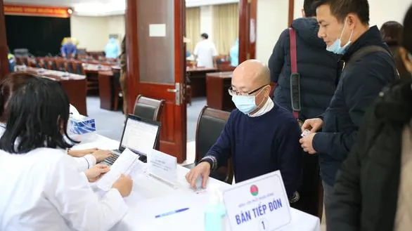 Xét nghiệm COVID-19 đợt 1 cho phóng viên tác nghiệp tại Đại hội Đảng ở Hà Nội