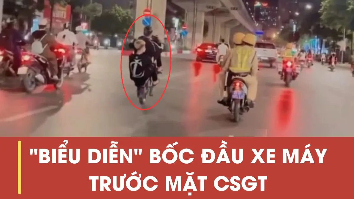 Hai thanh niên biểu diễn bốc đầu xe máy trước mặt cảnh sát giao thông